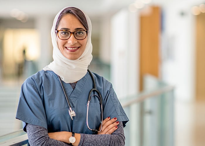 International nurse with hijab and scrubs on