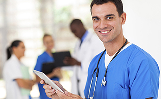 International nurse smiling with tablet International nurse smiling with tablet